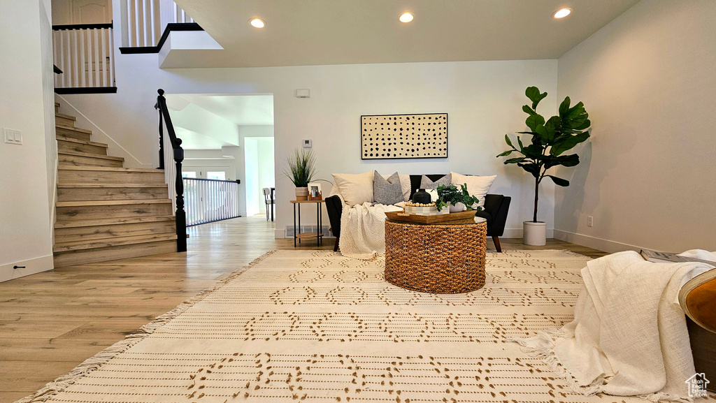 Living area with light hardwood / wood-style flooring