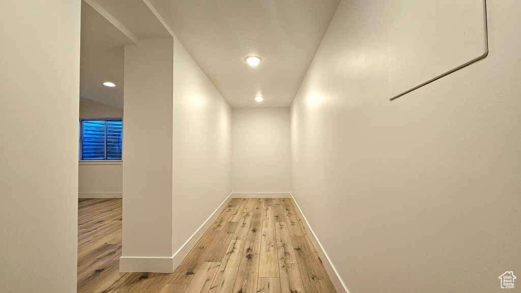 Hallway with light wood-type flooring