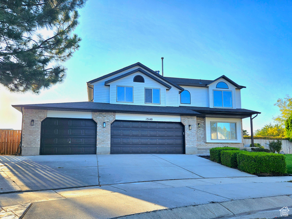 Front of property with a garage