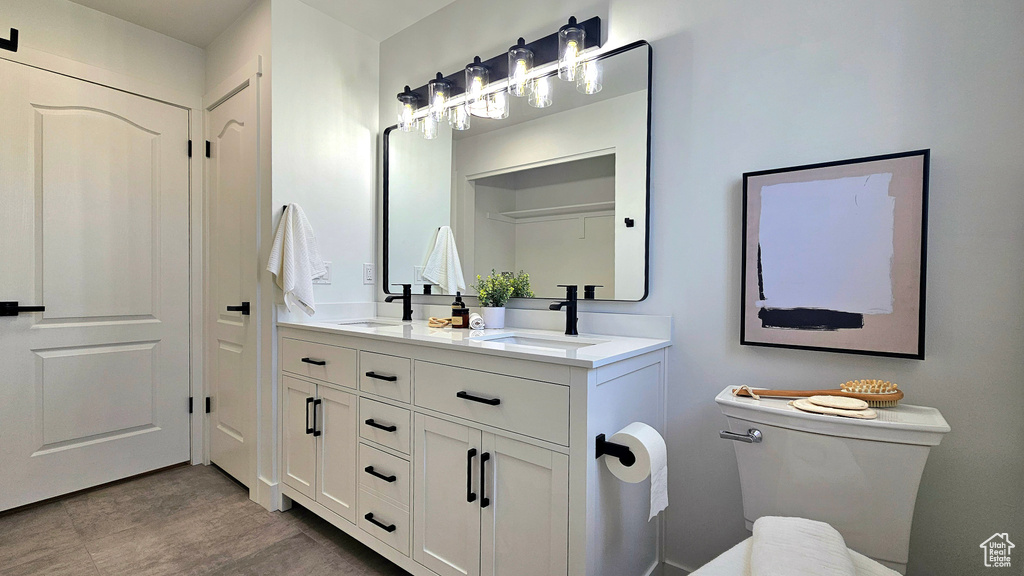 Bathroom with vanity and toilet