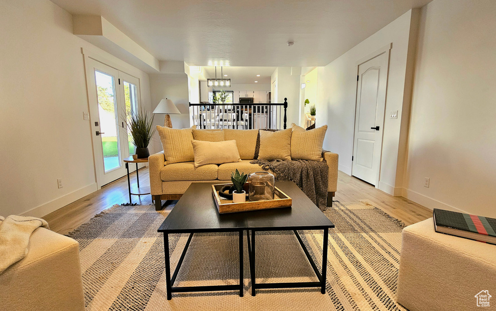 Living room with light wood-type flooring