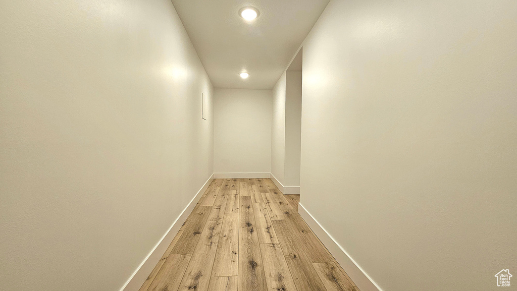 Hall featuring light wood-type flooring