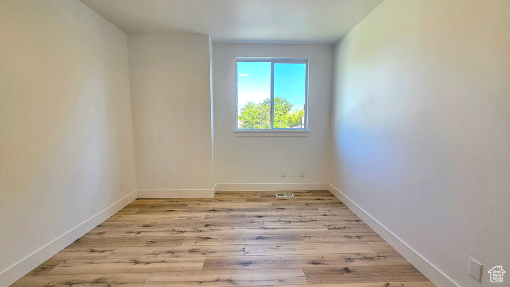 Spare room with light wood-type flooring