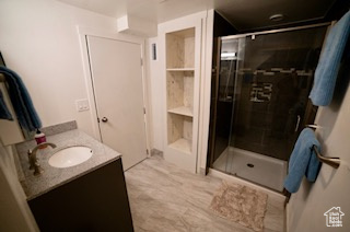 Bathroom with vanity and walk in shower