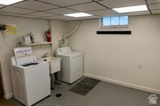 Washroom with washing machine and clothes dryer