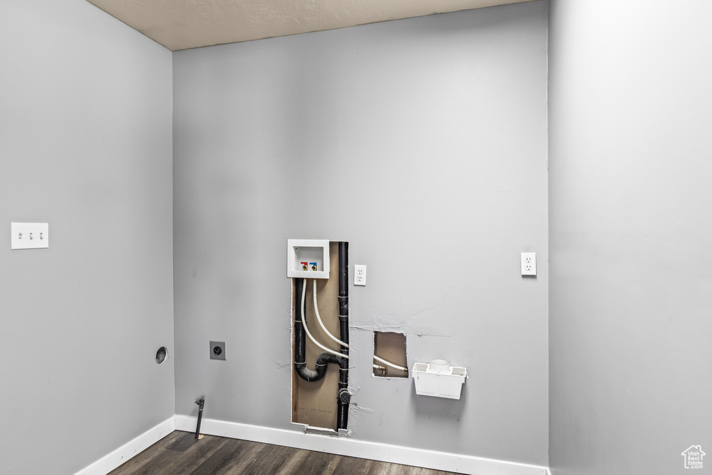 Clothes washing area featuring washer hookup, dark hardwood / wood-style floors, and electric dryer hookup