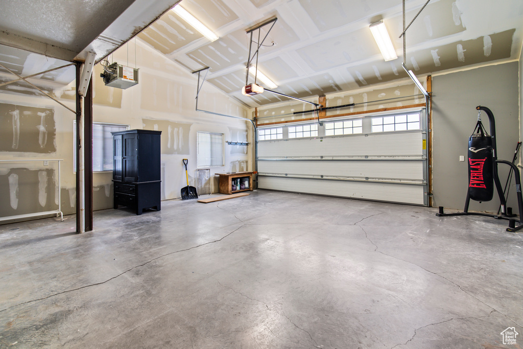 Garage featuring a garage door opener