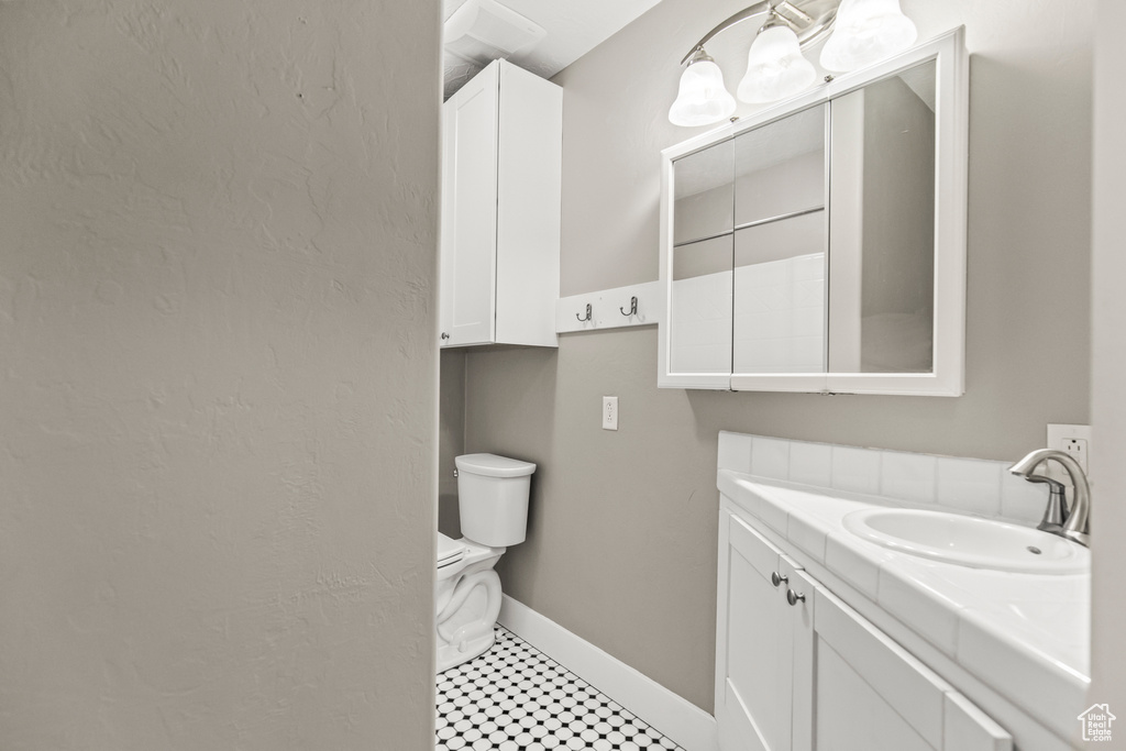 Bathroom with vanity and toilet