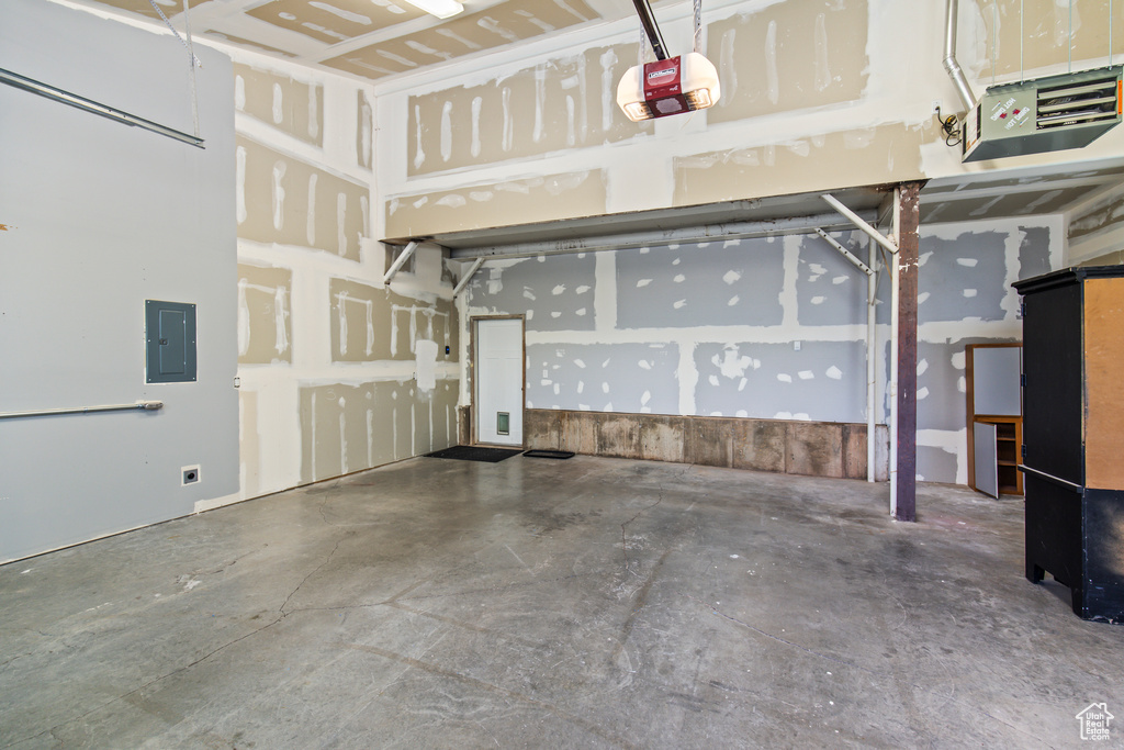 Garage with a garage door opener and electric panel