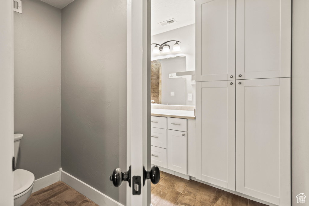 Bathroom with vanity and toilet