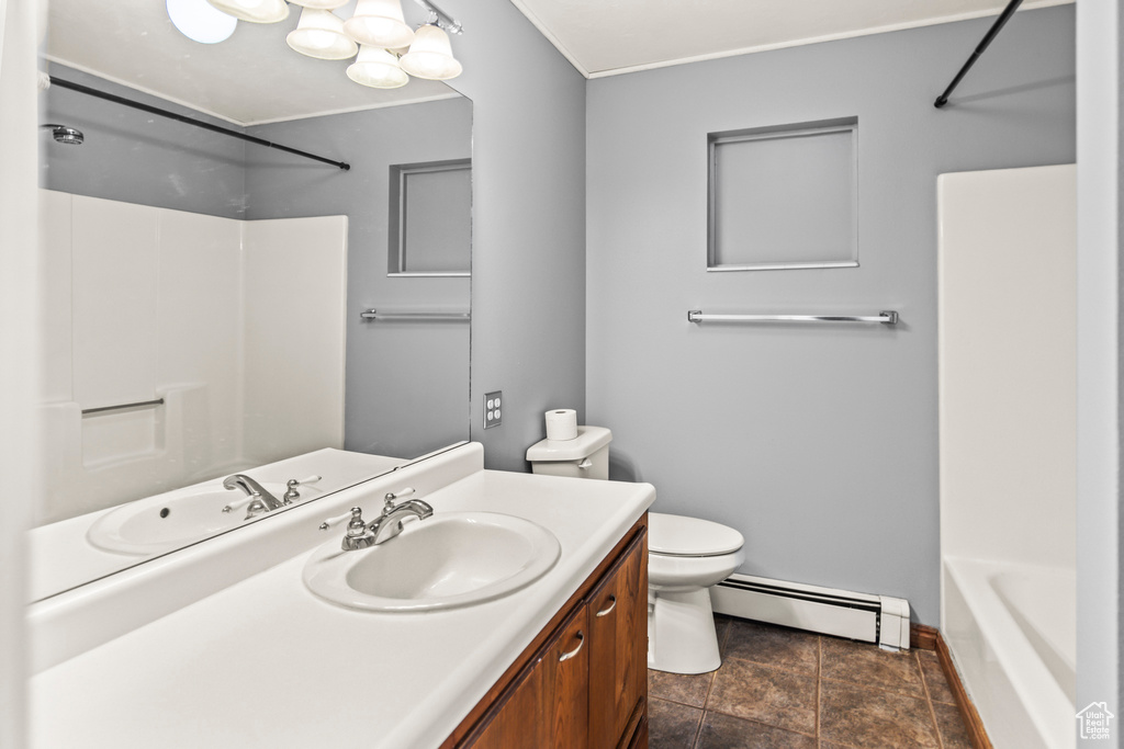 Full bathroom featuring shower / bathtub combination, vanity, toilet, and a baseboard heating unit