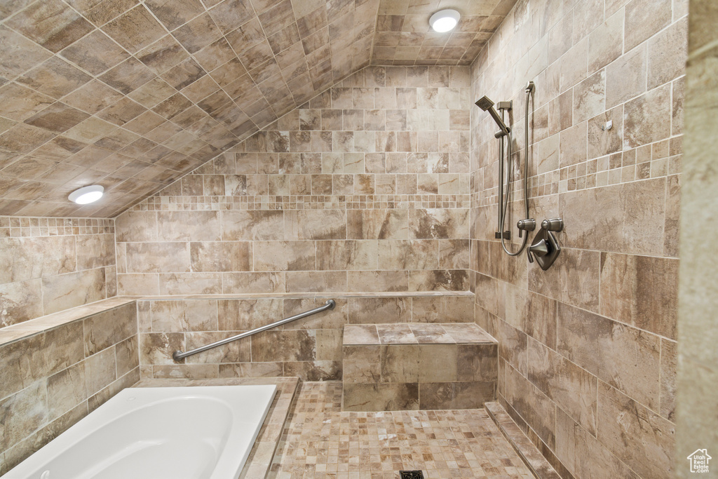 Bathroom with vaulted ceiling and independent shower and bath