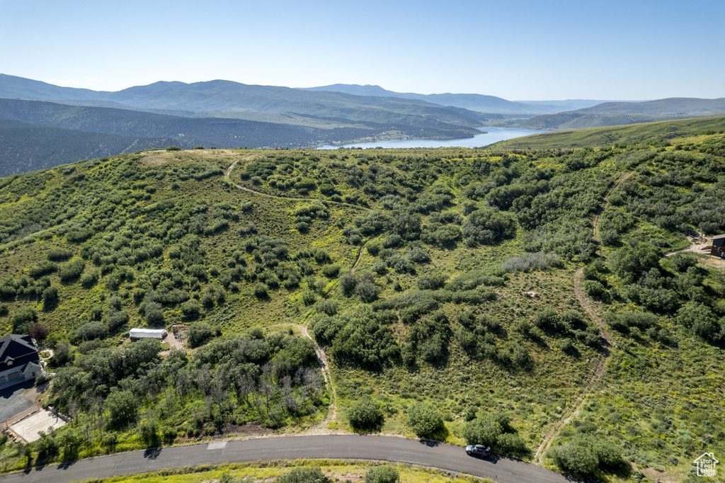 Aerial view featuring a water and mountain view
