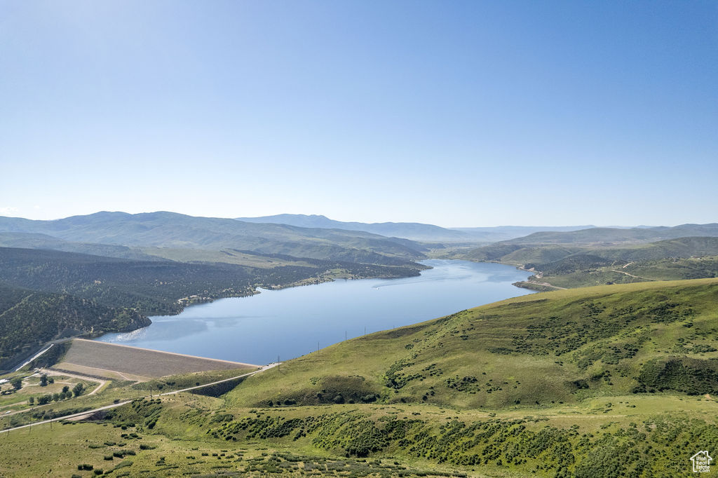 Property view of mountains featuring a water view