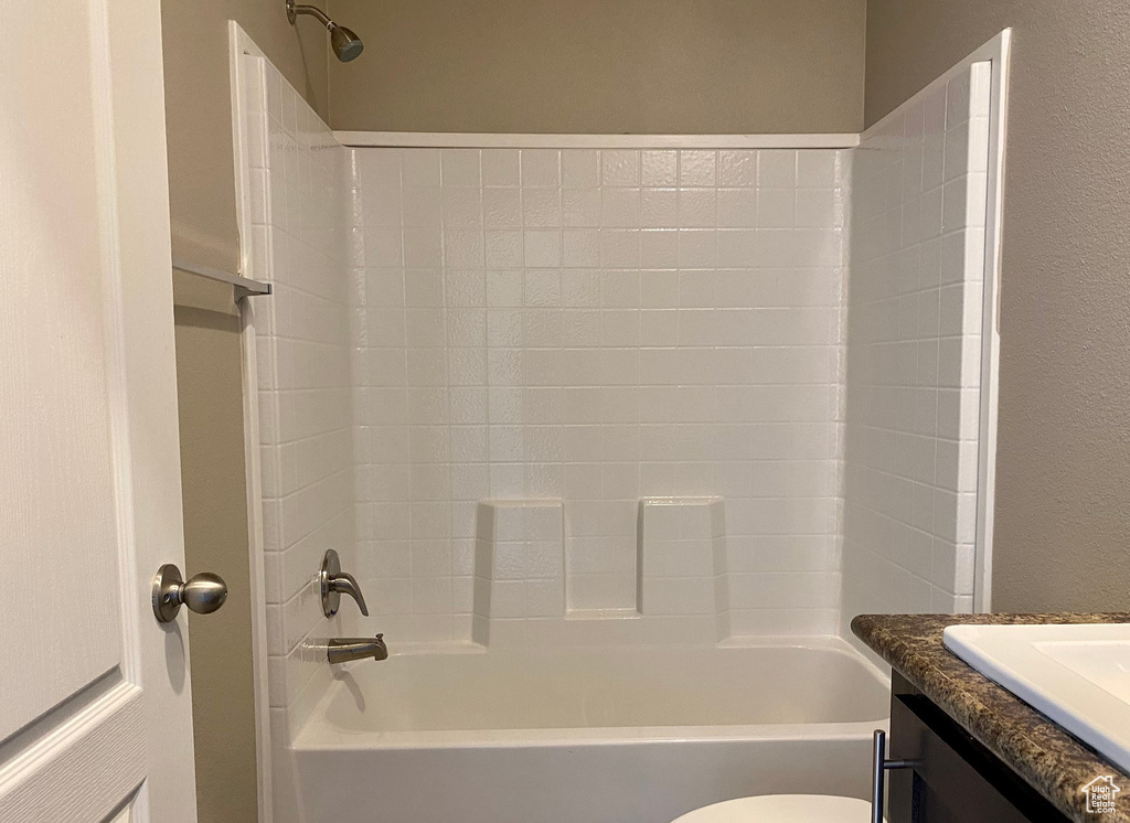 Full bathroom with vanity, toilet, and shower / bath combination