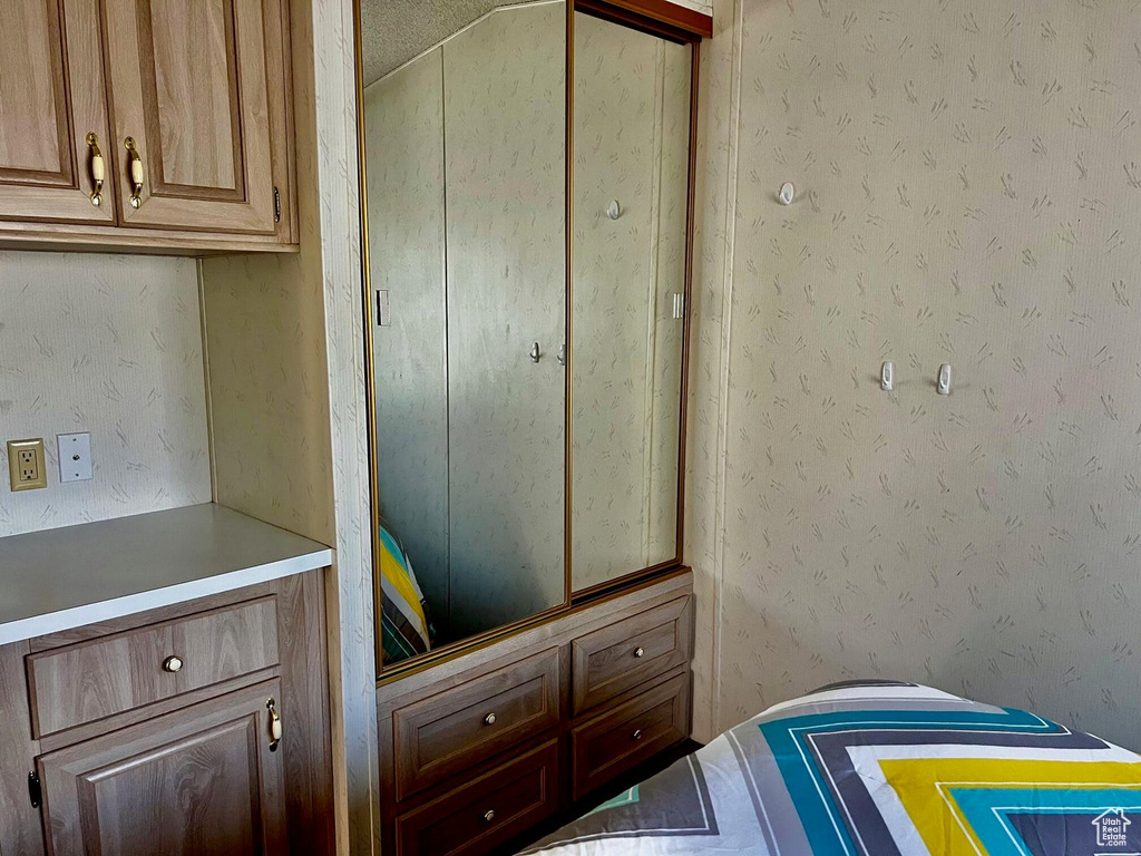 Bedroom with a closet and a textured ceiling