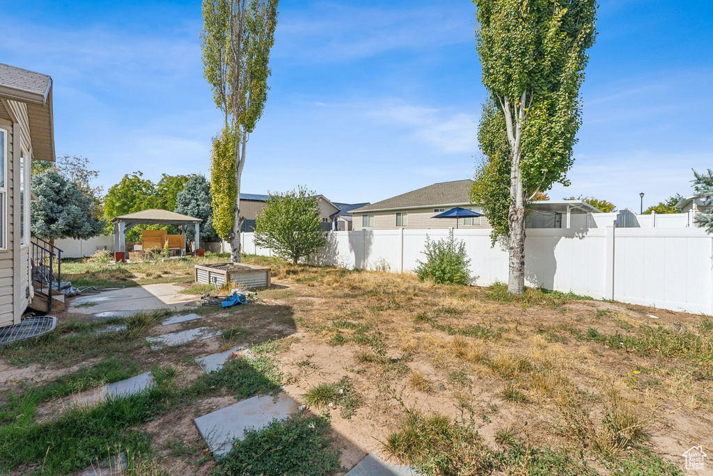 View of yard featuring a patio and a gazebo