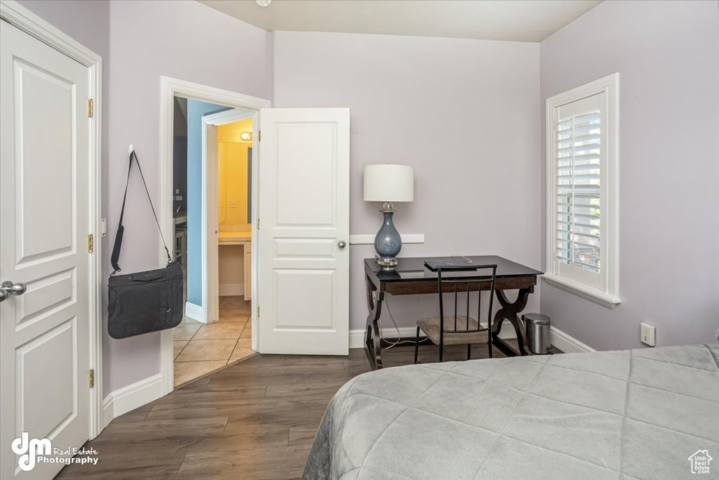 Bedroom featuring wood-type flooring