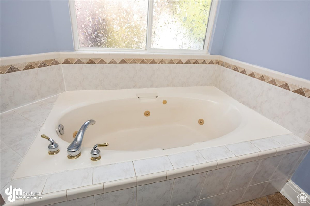 Bathroom featuring tiled tub