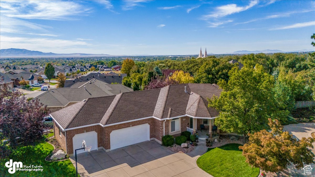 Birds eye view of property with a mountain view