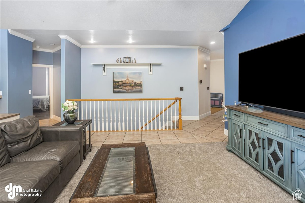 Carpeted living room featuring ornamental molding