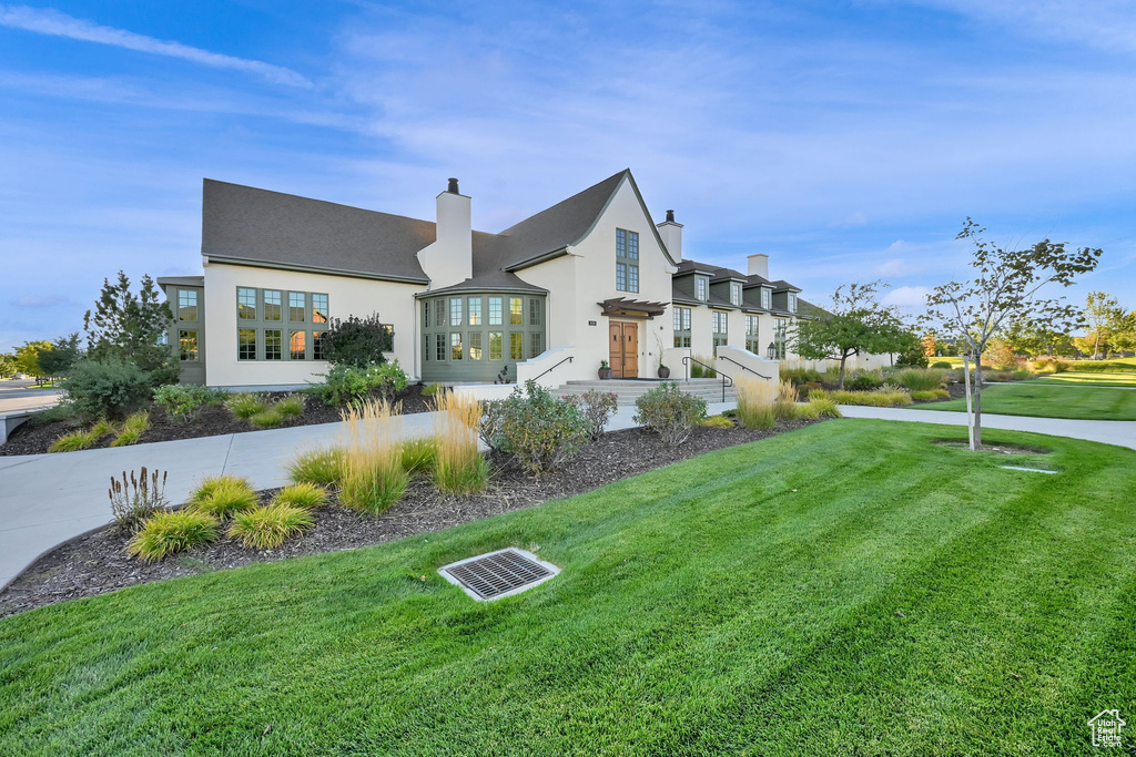 Exterior space featuring a front yard