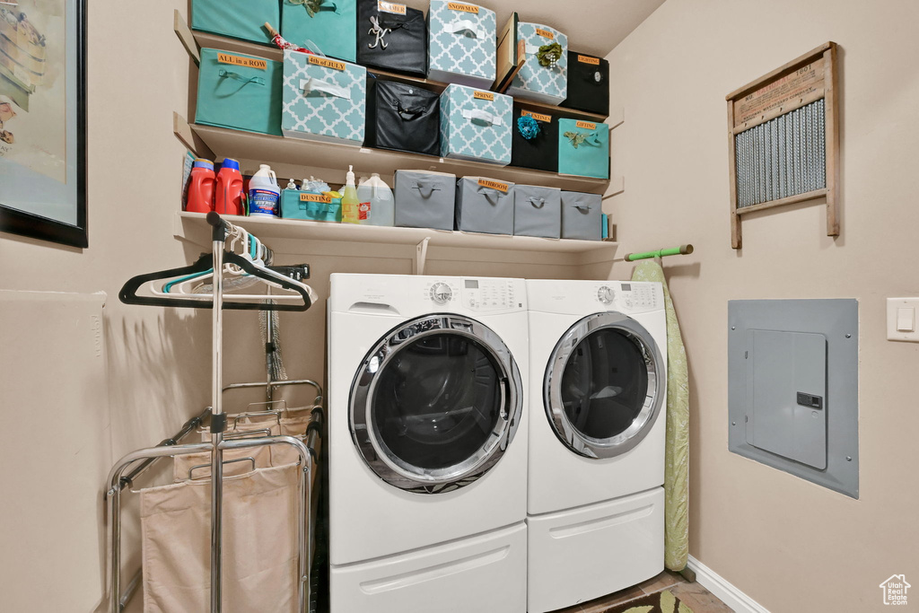 Washroom with electric panel and washer and dryer