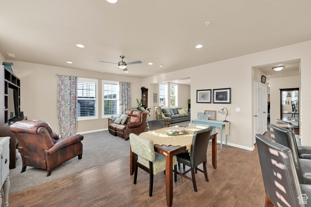 Dining space featuring wood-type flooring and ceiling fan