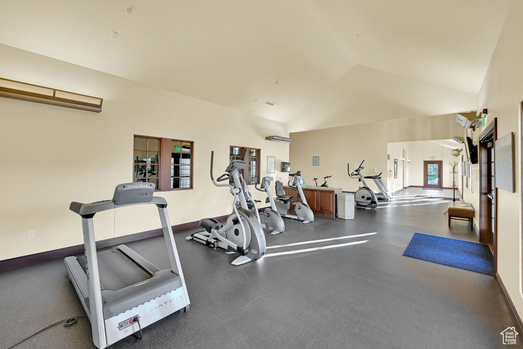 Gym featuring lofted ceiling