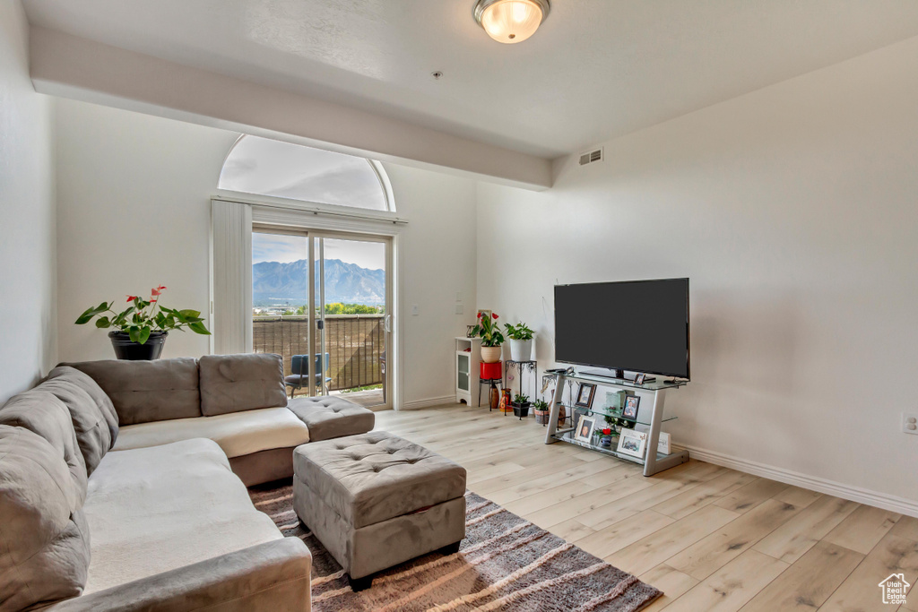 Living room with light hardwood / wood-style flooring