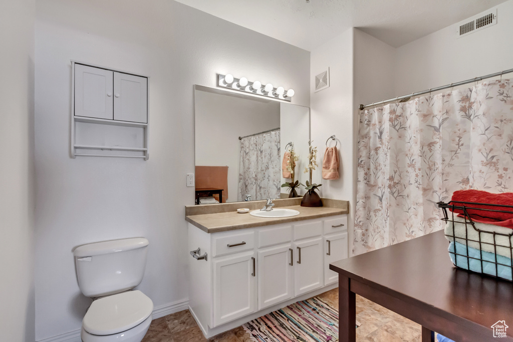 Bathroom with vanity and toilet