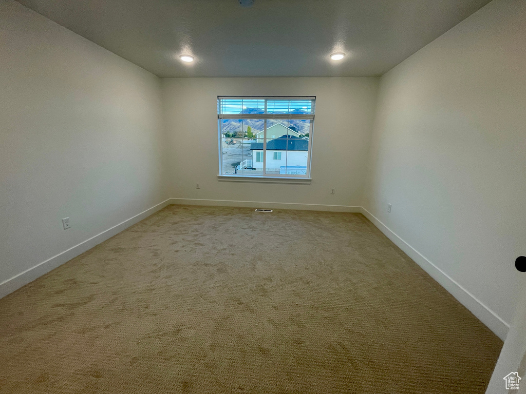 Unfurnished room featuring carpet flooring