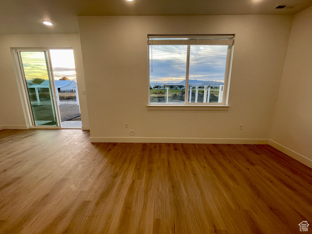 Spare room with light hardwood / wood-style flooring