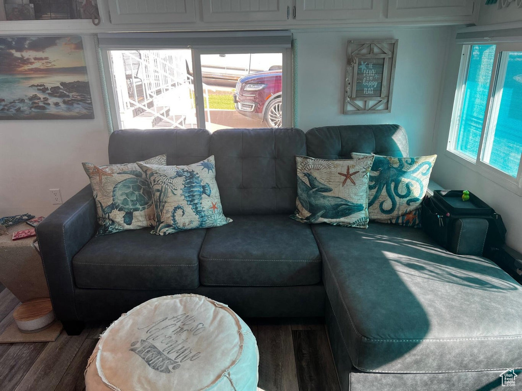 Living room with hardwood / wood-style flooring and plenty of natural light