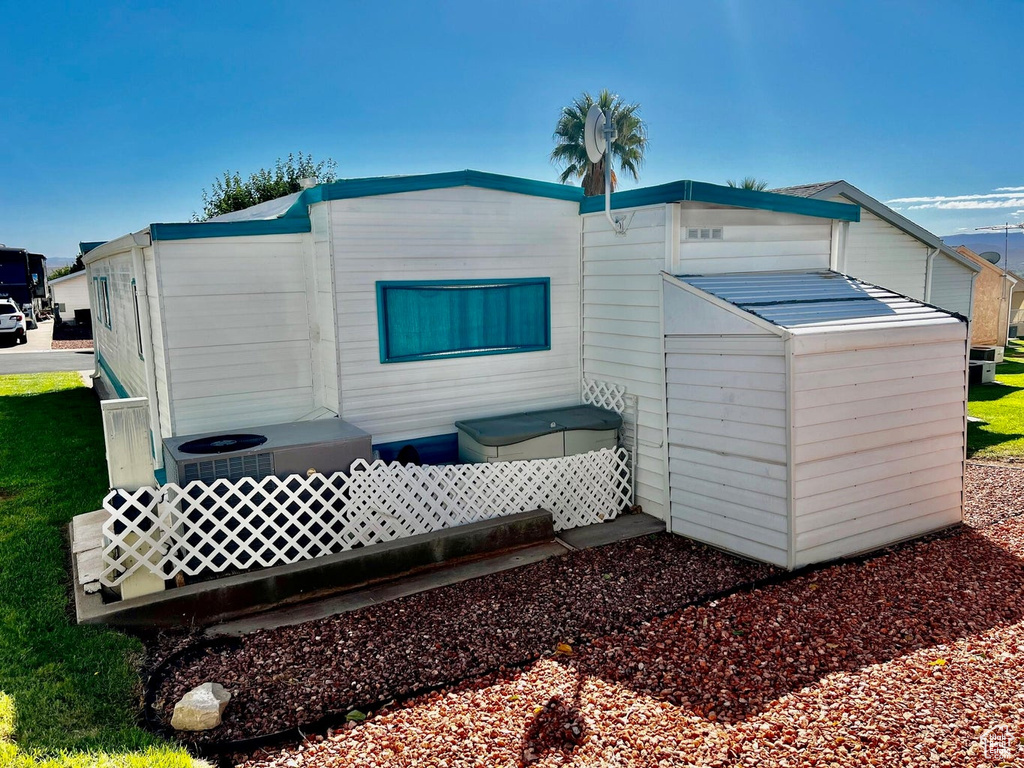 View of outdoor structure featuring central AC