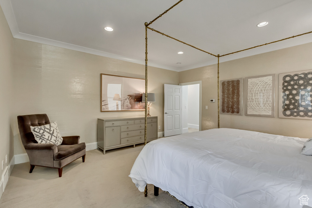 Carpeted bedroom featuring ornamental molding