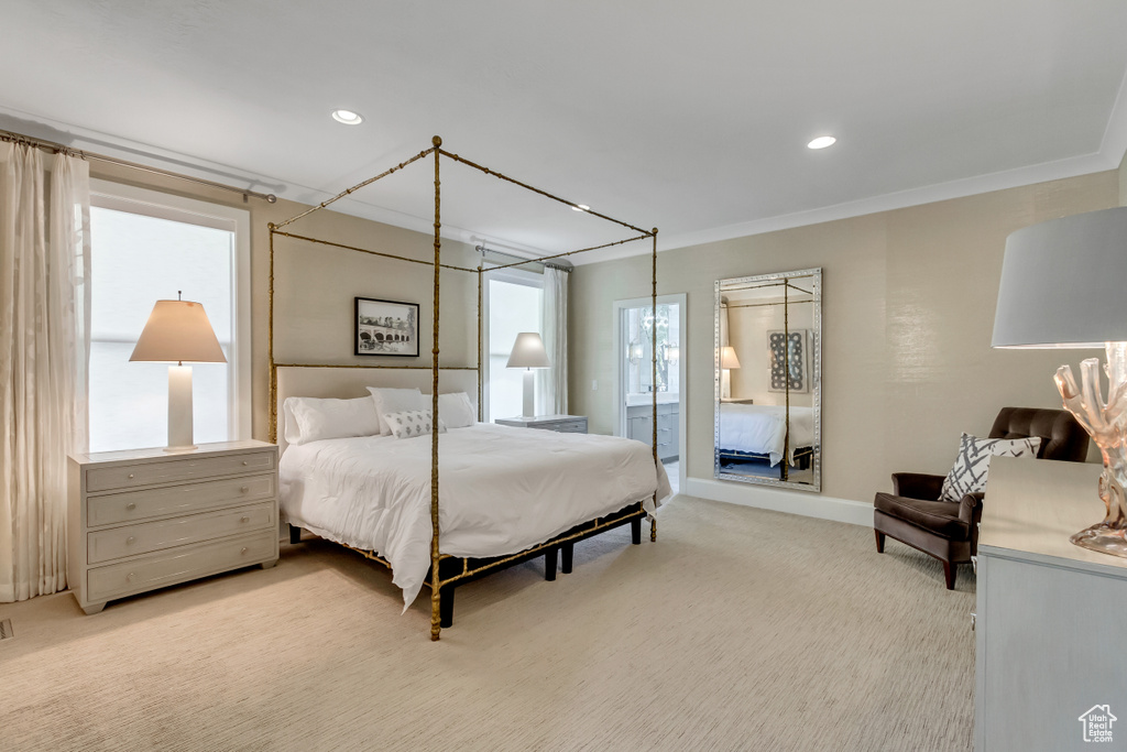 Bedroom featuring light carpet and ornamental molding