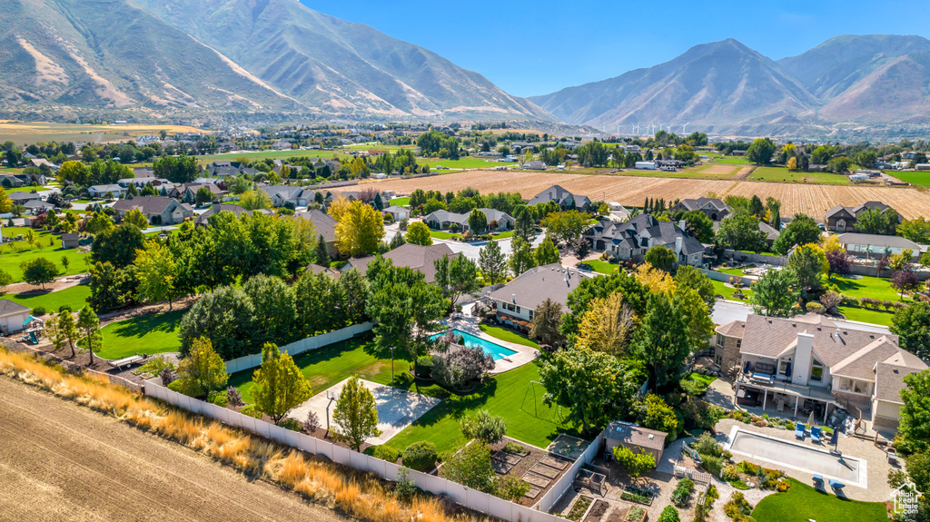 Birds eye view of property with a mountain view