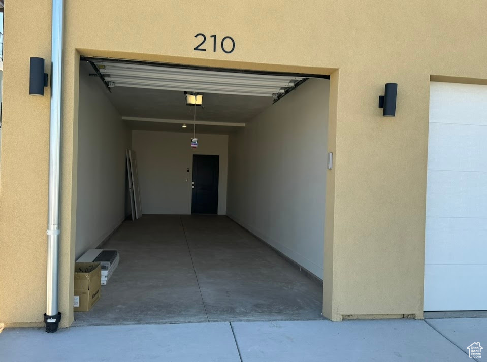 Exterior space featuring a garage door opener