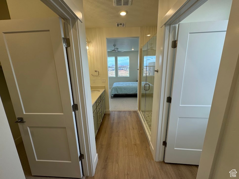 Hallway featuring light wood-type flooring