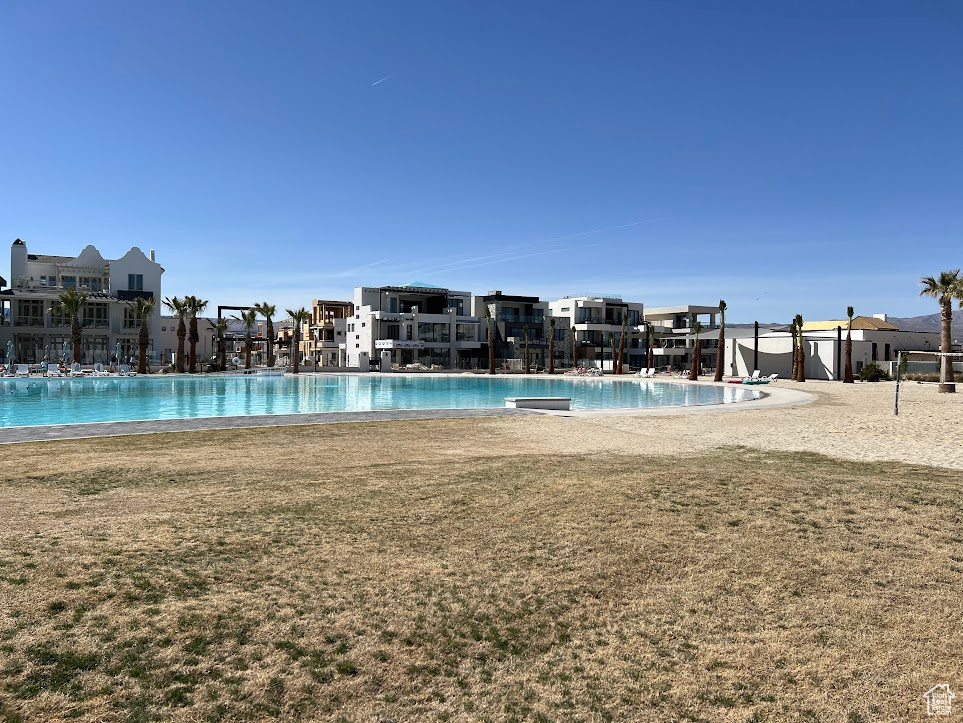 View of pool featuring a yard