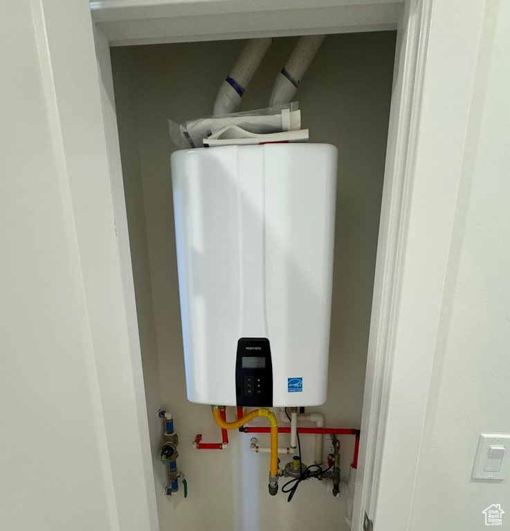 Interior space featuring tankless water heater