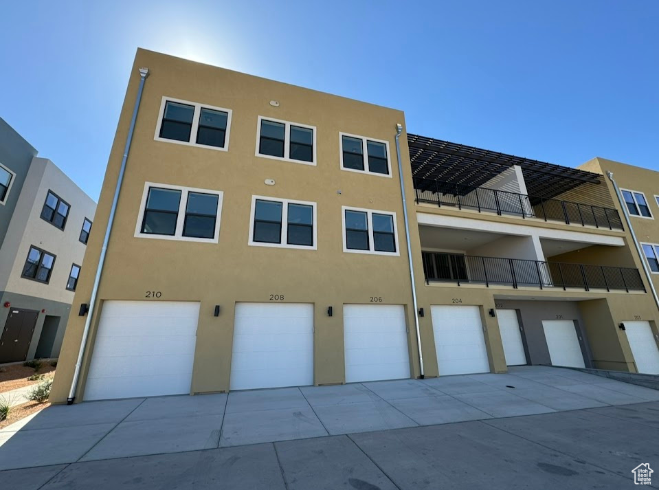 View of building exterior featuring a garage