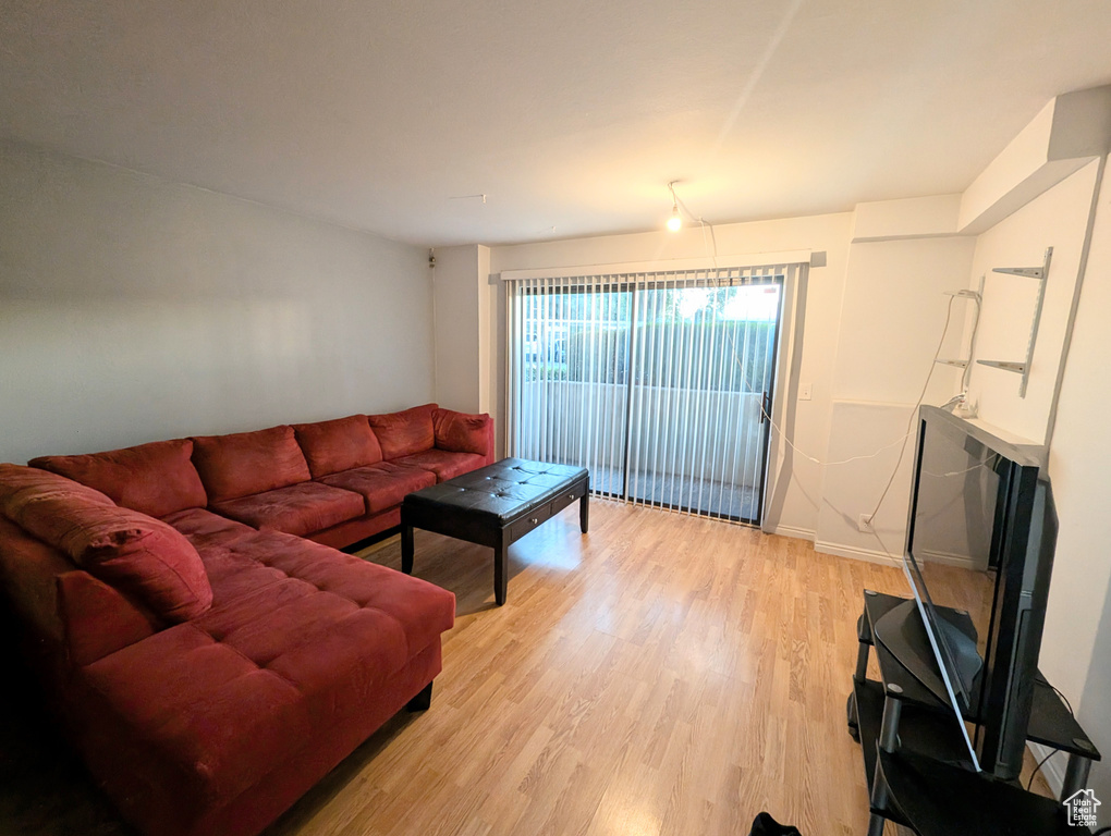 Living room with light hardwood / wood-style flooring