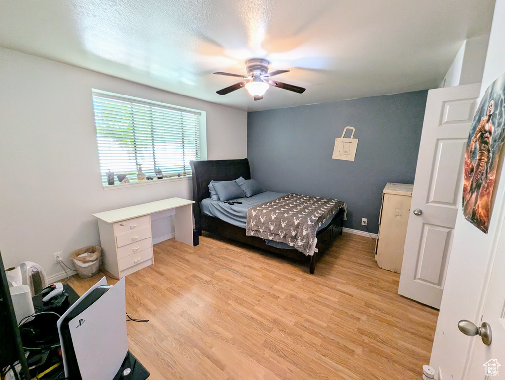Bedroom with light wood-type flooring and ceiling fan