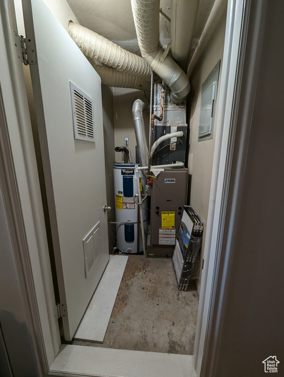 Utility room featuring electric water heater