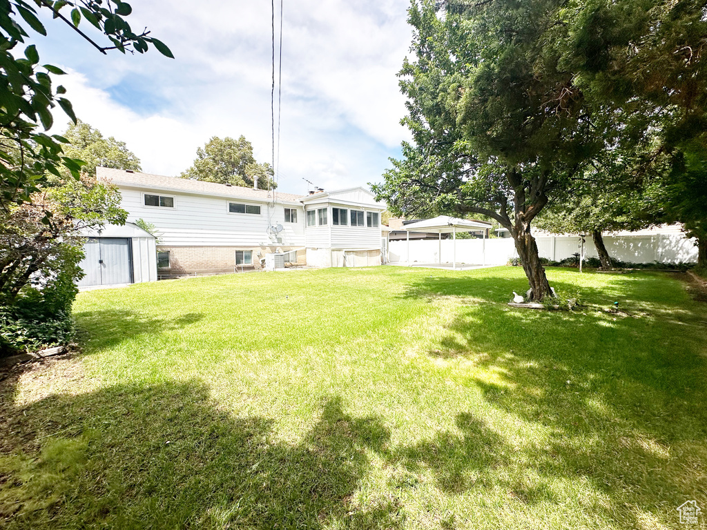 View of yard with a shed