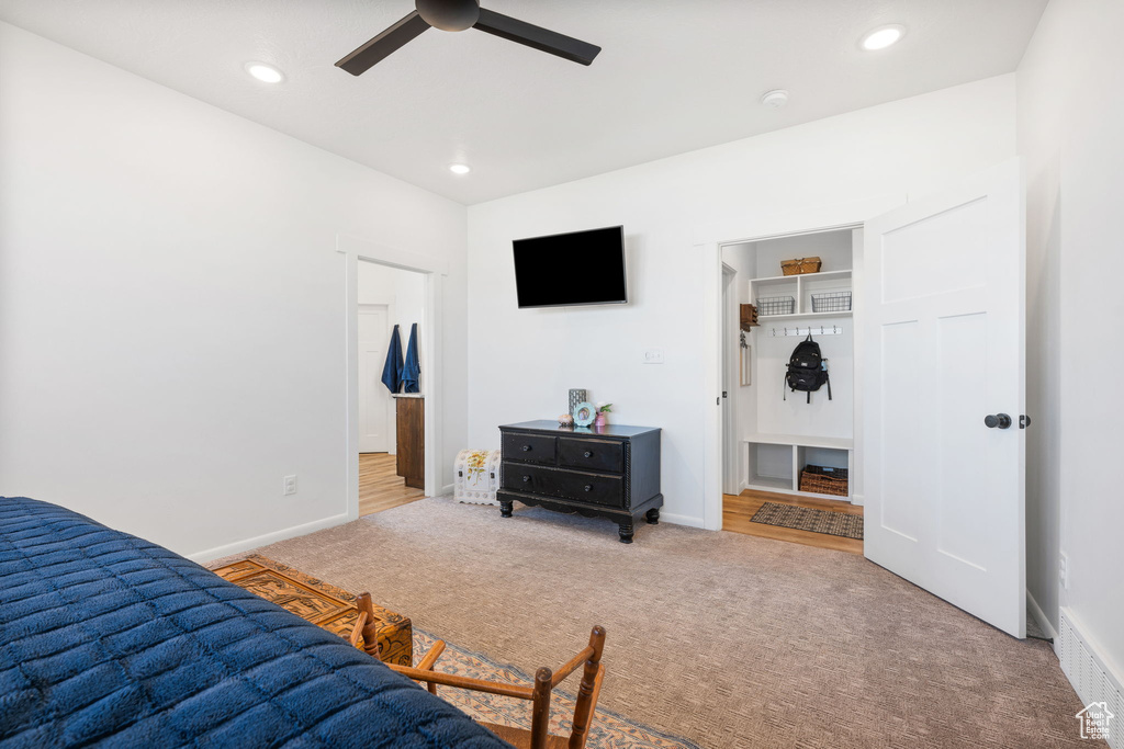 Bedroom featuring a closet, carpet, and ceiling fan