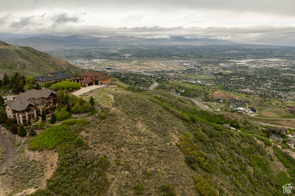 Aerial view of property's location with a mountain backdrop