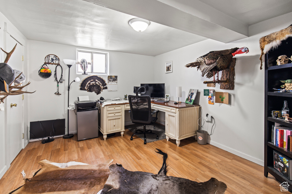 Office space with light wood-type flooring